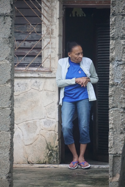 Woman standing in a doorway.